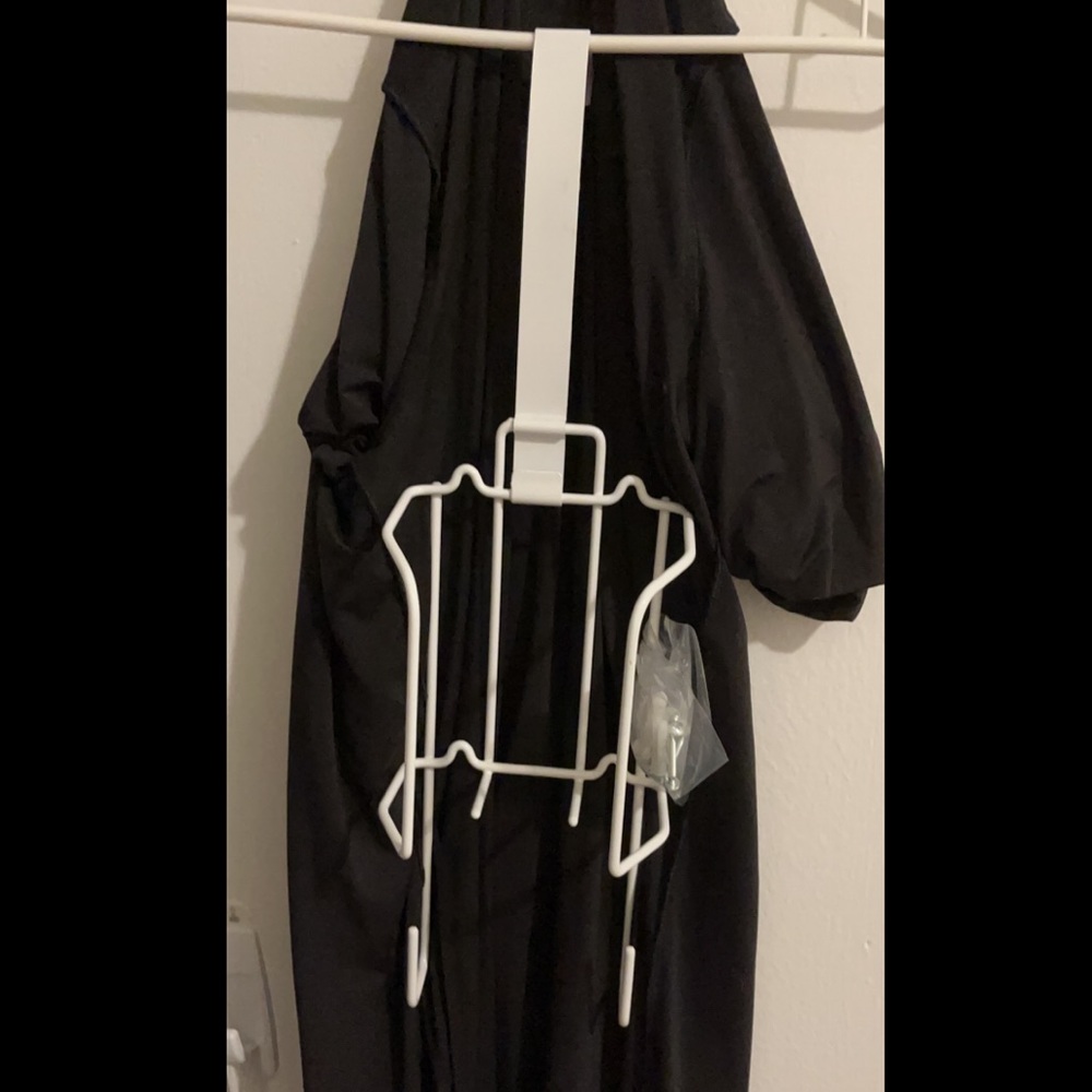 Never used Iron/ironing board holder